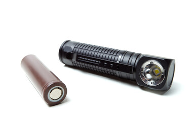 Battery pack and led flashlight isolated on white background.