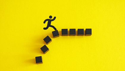 Person jumping over obstacles made of blocks. Personal growth.