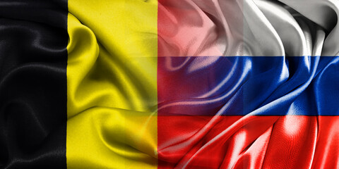 Obraz premium The national flags of Russia and Belgium are combined into one and placed side by side on a fluttering cotton background. Flags.