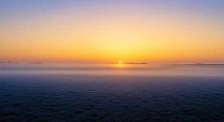 Foggy field at dawn horizon light grass below mist soft colors