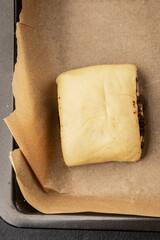 Raw poppy seed buns raw pastry dough baking sweet dessert tasty snack fresh delicious gourmet food background on the table rustic top view copy space