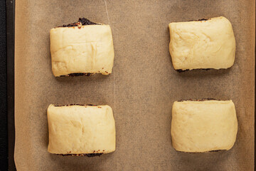 Raw poppy seed buns raw pastry dough baking sweet dessert tasty snack fresh delicious gourmet food background on the table rustic top view copy space