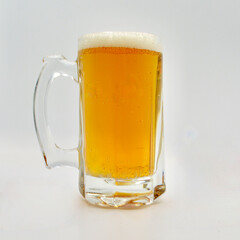 A pint of English style bitter isolated against a white background. 