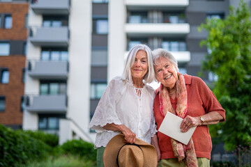 Fototapeta premium Portrait of beautiful adult daughter with old mother.