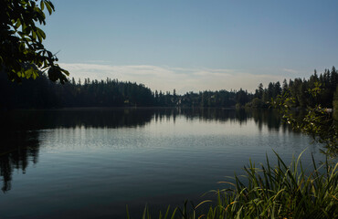 Lake Wilderness and Mount Rainier with deep shadows and blue sky from north shore