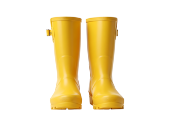 Bright yellow rain boots stand out against a black background.