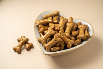Pet food, dry dog food in heart shaped bowl, bone shaped dog food in a bowl.