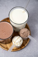 Protein powder and protein drinks, with scoops. Food supplement, bodybuilding, fitness and sport