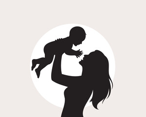 Silhouette of a mother holding her baby up high in a loving embrace symbol of family and togetherness