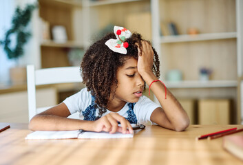 Portrait of teenage black girl using laptop computer and thinking and day dreaming looking through window at home. Teenage girl attending to online school class worried and tired with headache