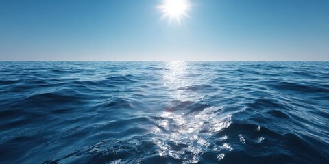 Obraz premium Serene Ocean Ripples Under Bright Sun and Clear Blue Sky