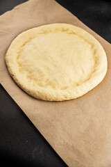 Raw pizza dough making pizza base tasty snack fresh delicious gourmet food background on the table rustic top view copy space