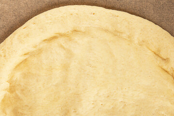 Raw pizza dough making pizza base tasty snack fresh delicious gourmet food background on the table rustic top view copy space