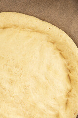 Raw pizza dough making pizza base tasty snack fresh delicious gourmet food background on the table rustic top view copy space