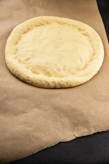 Raw pizza dough making pizza base tasty snack fresh delicious gourmet food background on the table rustic top view copy space