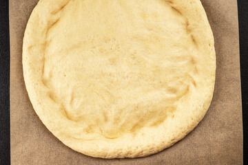 Raw pizza dough making pizza base tasty snack fresh delicious gourmet food background on the table rustic top view copy space