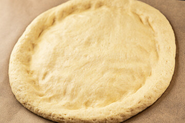 Raw pizza dough making pizza base tasty snack fresh delicious gourmet food background on the table rustic top view copy space