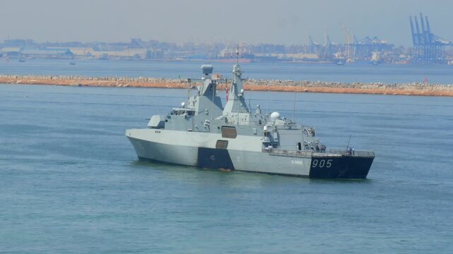 05.04.2025 Alexandria, Egypt - Egyptian navy warship number 905 docked at Alexandria naval base, modern military vessel with radar tower and naval fleet in background.