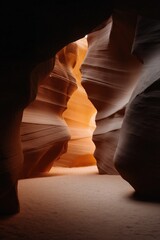 Sunlight illuminating sandstone curves in antelope canyon