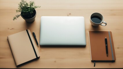 Clean wooden desk setup with closed laptop notebook and coffee cup for productive work