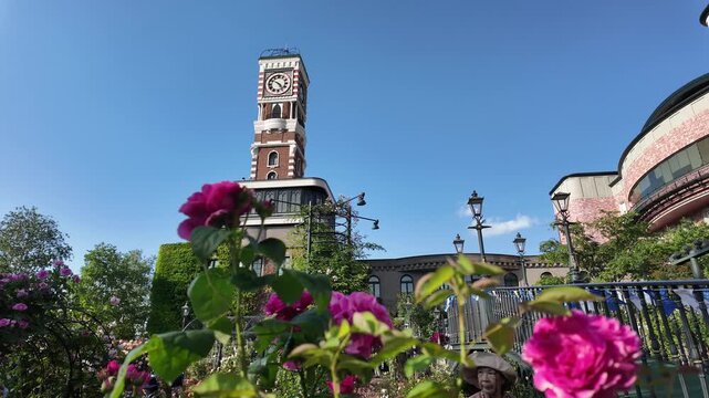 A picturesque scene featuring a historic clock tower amidst vibrant flowers, showcasing the beauty of architecture blended with nature. Ideal for those interested in urban landscapes and floral design
