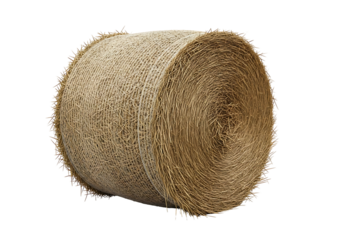 Close-up of a tightly rolled bale of hay against a black background, showcasing its intricate texture and natural color.