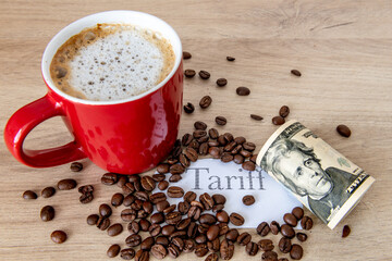 A cup of coffee, coffee beans, the printed word tariff and a roll of US Dollar bills on a table. A coffee tariff concept.