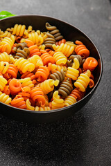pasta trottole tricolor pasta spiral dish twisted Italian food tasty snack fresh delicious gourmet food background on the table rustic top view copy space  vegan and vegan food