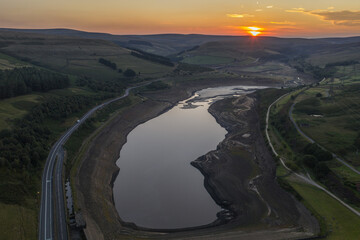 Fototapeta premium Scenic Sunset Aerial View Over a Dry Reservoir in Derbyshire Countryside