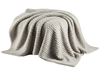 A soft, textured, light beige blanket draped elegantly, showcasing a cozy and inviting style.