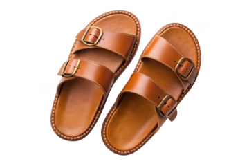 Pair of brown leather double strap sandals isolated on transparent background