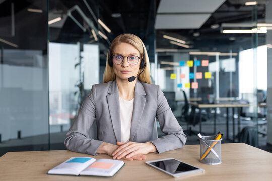 Professional Woman in Office Headset Conducting Remote Conference or Meeting