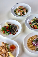 Colorful assortment of healthy salads and main courses