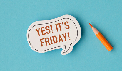 A yellow pencil is on a blue background with a white sticker that says Yes It's Friday