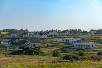 View of newly built modern suburban houses in a quiet residential area.