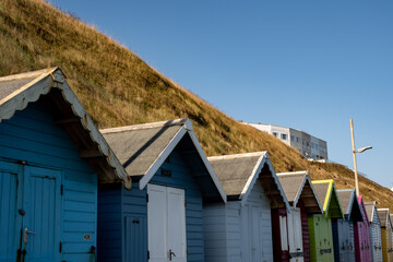 Naklejka premium Traditional wooden beach huts on Sheringham beach, Norfolk Coast