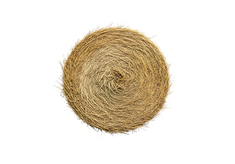 A circular roll of straw displays a natural, textured surface against a stark black background.