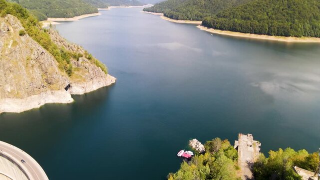 Barajul Vidraru Dam on Transfagarasan Highway, Romania. Aerial panoramic drone view from above, top view from drone . Summer holidays in Europe. The most beautiful road in the world, amazing scenery v