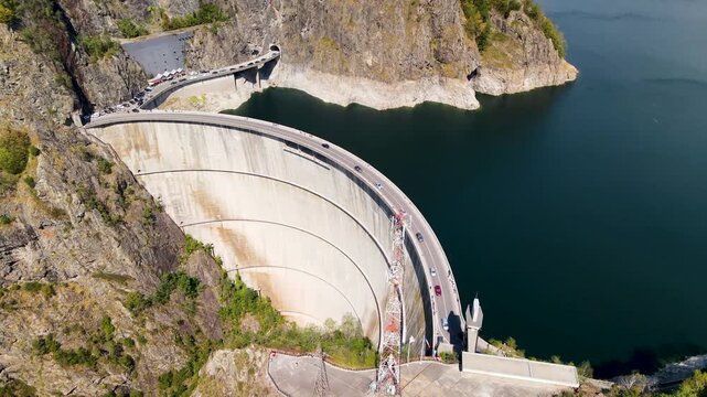 Barajul Vidraru Dam on Transfagarasan Highway, Romania. Aerial panoramic drone view from above, top view from drone . Summer holidays in Europe. The most beautiful road in the world, amazing scenery v