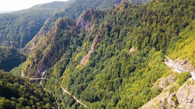 Barajul Vidraru Dam on Transfagarasan Highway, Romania. Aerial panoramic drone view from above, top view from drone . Summer holidays in Europe. The most beautiful road in the world, amazing scenery v