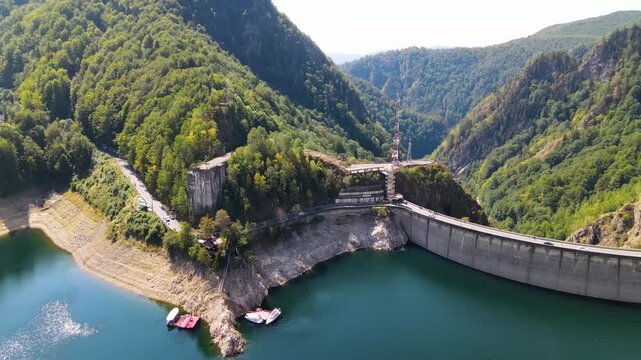 Barajul Vidraru Dam on Transfagarasan Highway, Romania. Aerial panoramic drone view from above, top view from drone . Summer holidays in Europe. The most beautiful road in the world, amazing scenery v