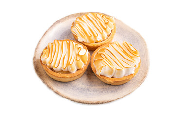 French lemon tart with meringue isolated on white, side view, close up