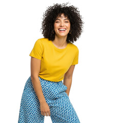 Joyful woman in yellow top and blue patterned pants smiling against a solid backdrop transparent background