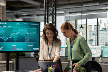 Corporate women team working on data analysis and setting project goals, empowered and ambitious coworkers doing business planning. Goals oriented collaboration drives modern success.