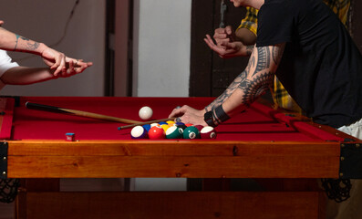 young woman playing pool
