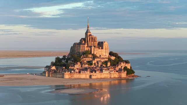Cinematic aerial view of the Mont Saint Michel in Normandy France at sunrise
