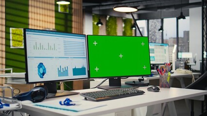 Empty office environment showcases tech tools of green screen and resources essential for business planning, performance analysis and the development of insights for innovation.