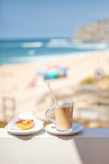 Coffee and Pastel de Nata by the Beach in Praia Azul Portugal