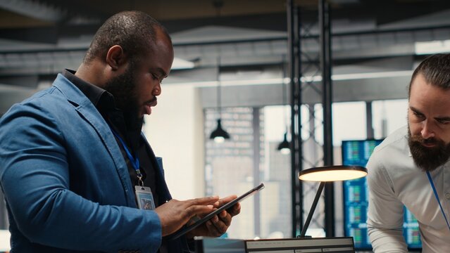 Professional colleagues team analyzing online graphs and resource allocation, demonstrating engagement and synergy between coworkers as they prepare performance reports. Networking. Camera B.
