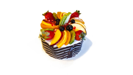 Fruit cake with chocolate decoration.
